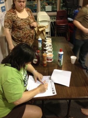 All-Star Desk Staff Becci Barnett & volunteer Marie Burke organizing ice cream